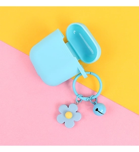 Detail of light blue silicone case featuring small flower and bell charm accessories