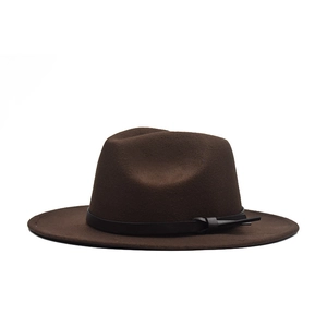 Detail of dark brown wool fedora hat with flat brim and black belt buckle decoration