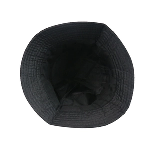 Detail view of the durable black bucket hat showing interior stitching and woven texture