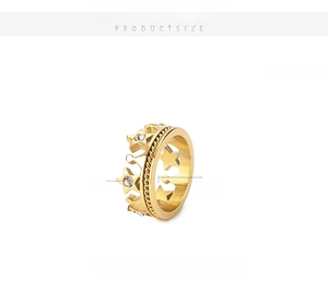 Detail view of gold-plated stainless steel crown ring with stars and zircons