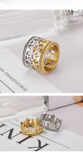 Detailed view of gold and silver star crown rings with sparkling crystal center