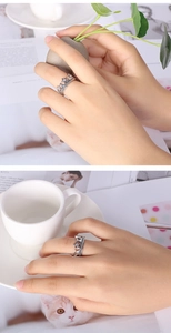 Detailed view of an elegant silver crown ring with sparkling crystals on a model finger