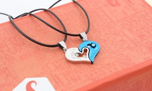 Detailed macro view of heart-shaped puzzle necklace with sparkling rhinestones and engraving