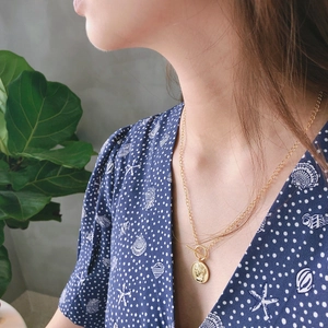 925 silver double-layered necklace with gold embossed coin pendant and toggle clasp