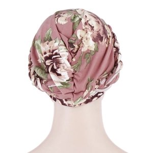 Back view of pink floral turban headscarf showing intricate twisted braid knot detail