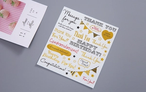 Detail view of gold and silver foil letter stickers for scrapbooking and DIY crafts