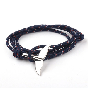 Detailed view of nautical rope bracelet with a silver-tone whale tail anchor clasp
