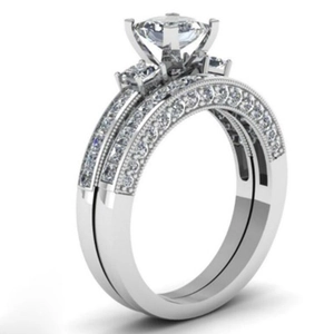 Elegant silver bridal ring set with princess cut diamond and micro-pave crystals