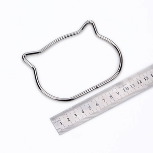 Detail of silver cat-ear shaped metal handle for DIY bags with 11.5cm width measurement