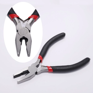 Macro detail of jewelry pliers with anti-slip handle and spring-loaded steel jaws
