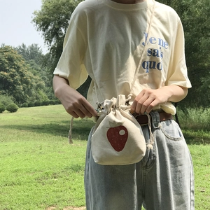 Japanese style beige canvas drawstring bucket bag with cute strawberry illustration
