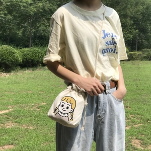 Japanese style beige canvas bucket bag with cartoon girl illustration and thin strap