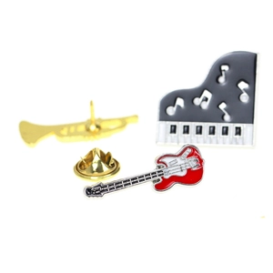 Detailed close-up of zinc alloy music pins featuring trumpet, piano, and electric guitar