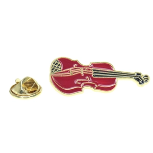 Detail of red and gold enamel violin brooch with metal strings and butterfly clutch