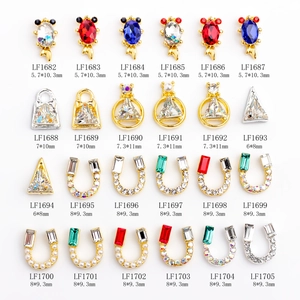 Detailed catalog of 24 3D butterfly nail charms in diverse styles and color finishes