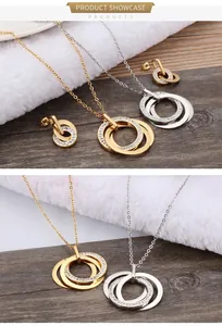 Detail of interlocking ring jewelry set with crystal pavé in gold and silver finish