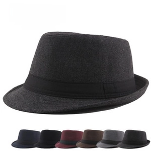 Detail of hand-woven straw hat showing breathable hollow pattern and foldable jazz fedora style