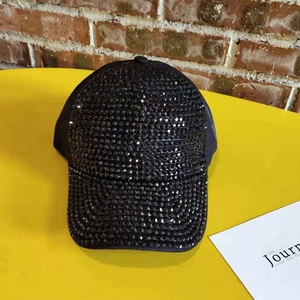 Detailed view of the sparkling black rhinestones and texture on the baseball cap