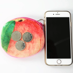 Cute peach-shaped plush coin purse with pink zipper and silver bead chain