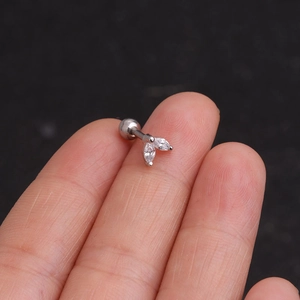 Close-up of small silver screw-back stud earrings with three marquise-cut cubic zirconia
