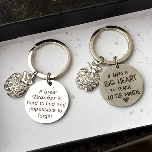 Silver stainless steel teacher gift keychains with apple charms in a black gift box