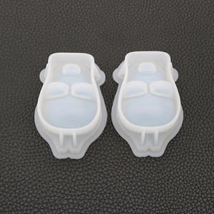 Detail of two translucent silicone pig molds for DIY resin casting and jewelry making