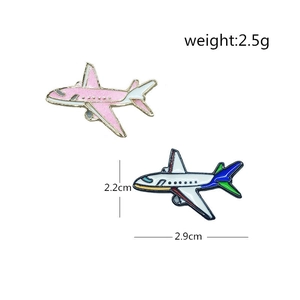 Pink glitter airplane enamel pin and colorful passenger jet brooch in metal with dimensions