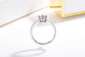 Close-up of classic six-prong solitaire ring with adjustable band and sparkling zircon