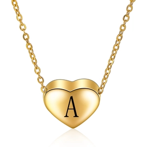 Minimalist gold heart pendant necklace with laser engraved capital letter A on a white background