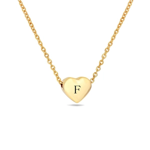 Close-up of gold heart pendant necklace featuring engraved letter F on a fine chain