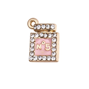 Macro detail of perfume bottle pendant with pink enamel, crystals and N°5 engraving