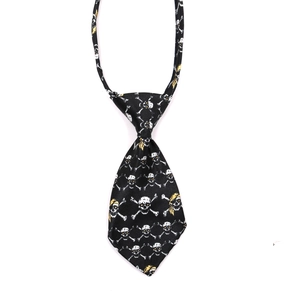 Halloween pet tie featuring white skull patterns on black fabric with yellow details