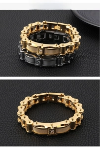 Detail of stainless steel motorcycle chain bracelet with cubic zirconia in gold and black