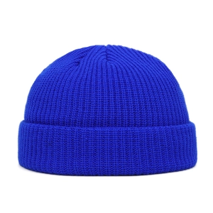 Close-up of the royal blue ribbed knit texture on the cuffed beanie winter hat