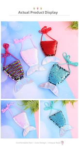 Detail view of colorful mermaid tail sequin purses in pink, blue, red and rainbow colors