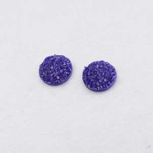 Macro detail of 10mm purple starry resin druzy cabochons for DIY jewelry making