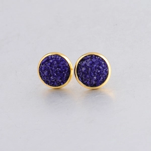 Detail of 10mm round gold plated earrings featuring dark blue mineral druzy stones
