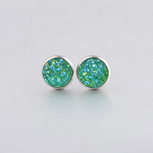 Macro shot of 10mm green drusy stud earrings with sparkling resin and silver borders