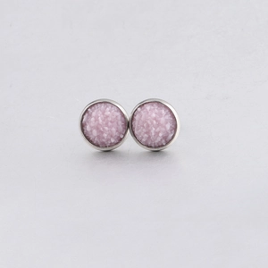 Macro shot of 10mm pink drusy stud earrings with sparkling crystal texture and silver base