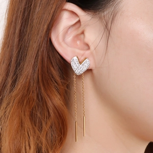 Titanium steel heart earrings with crystals and long tassels on a female model