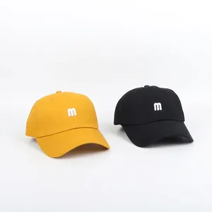 Classic baseball caps in yellow and black cotton canvas with M letter embroidery
