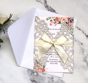 Silver glitter laser cut wedding invitation set with floral card and satin bow