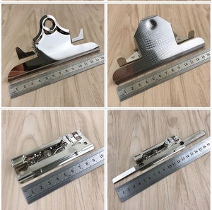 Detailed views of four silver stainless steel clipboard clips and metal binder mechanisms