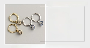 Detailed view of S925 sterling silver evil eye hoop earrings with blue and white zircons
