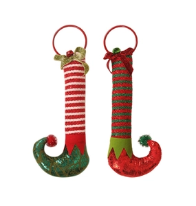 Detail of Christmas elf legs door hangers with striped patterns and jingle bell bows