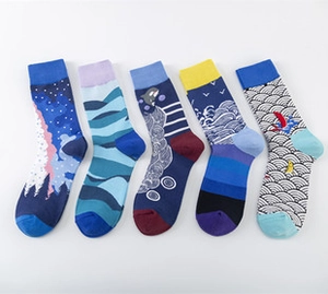 Detailed view of five pairs of crew socks with colorful Ukiyo-e wave and bird patterns