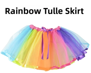 Detailed view of kids rainbow mesh tutu skirt featuring vibrant colors and a purple bow