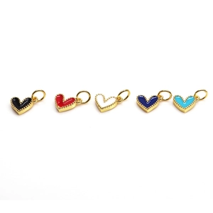 Set of five colorful enamel heart charms with gold loops on a clean white background