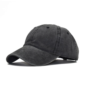 Detail of vintage washed dark gray cotton baseball cap showing texture and stitching