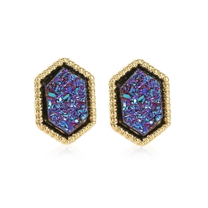 Hexagonal gold earrings with blue star-themed crystals shown on a clean white background
